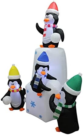 Два божиќни украси за украси, вклучуваат пингвини со надувување високи 8 стапки кои играат снежни топки во снегот, и 8 нозе високи надуени