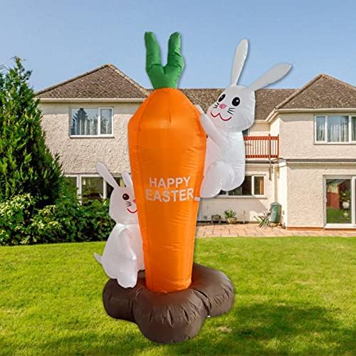 Велигденски празник надувување на зајакот на отворено Декорација на отворено слатки зајаци и зајаци украсени со моркови испратиле фустан за настани во градинарск