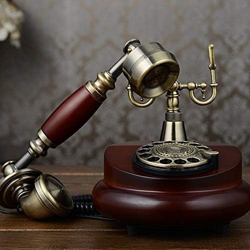 Злбиб дома старомоден ротирачки телефонски часовник, го прави Ен одлично парче акцент за секоја просторија, црвена боја