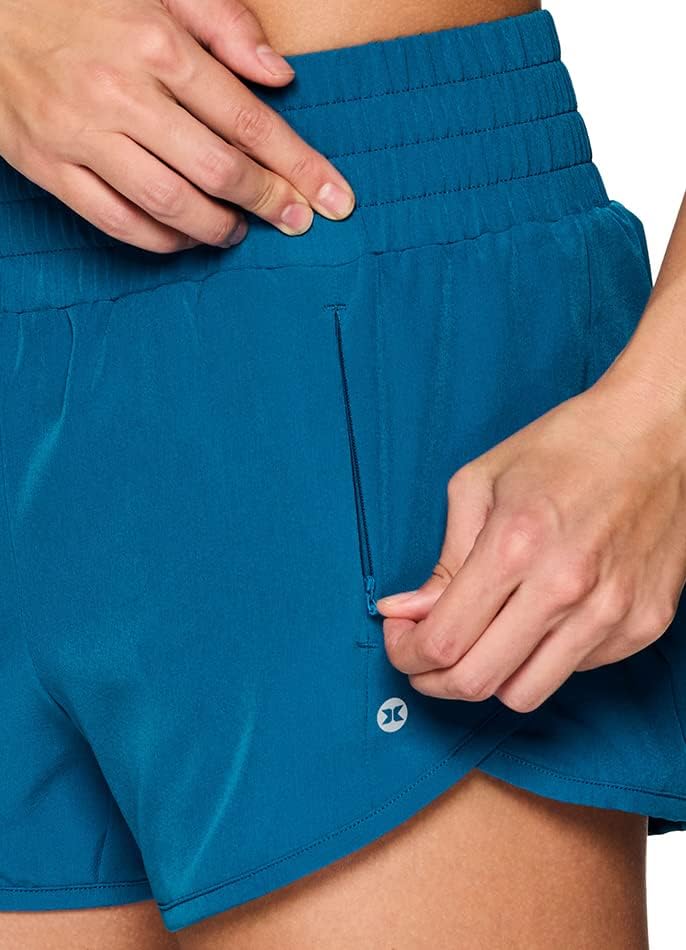 RBX активни женски атлетски опуштени се вклопуваат брзо суво истегнување ткаени кратко со внатрешно прицврстено кратко и џебови